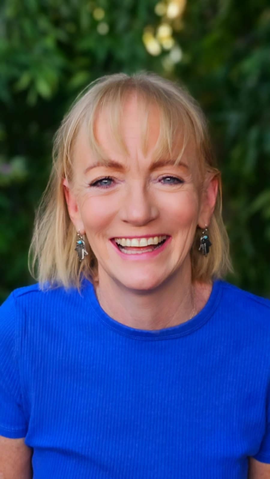 Katrina Gall, founder of Trine, laughing outdoors